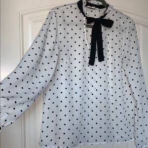 White blouse with black polka dots